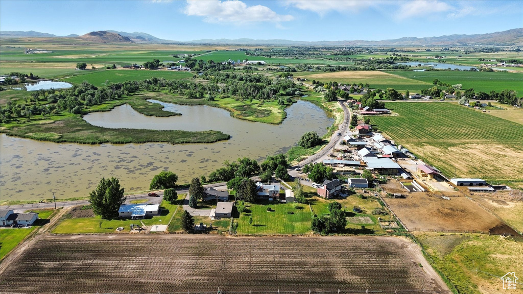 Overview of rural landscape featuring a water and mountain view
