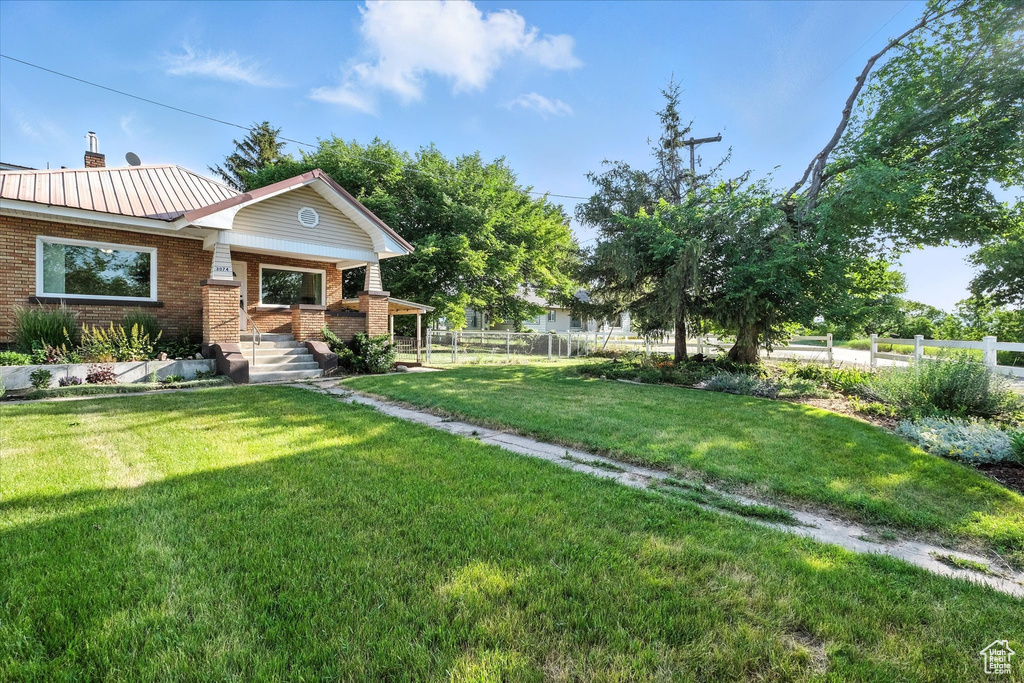 View of yard with covered porch