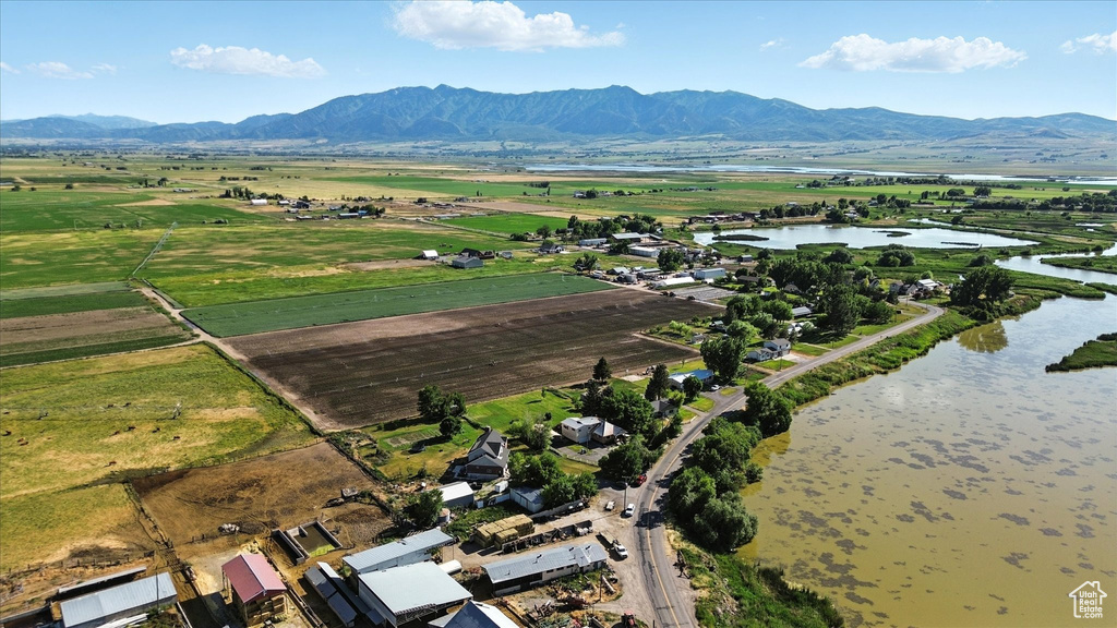 View of property location with a water and mountain view and rural landscape