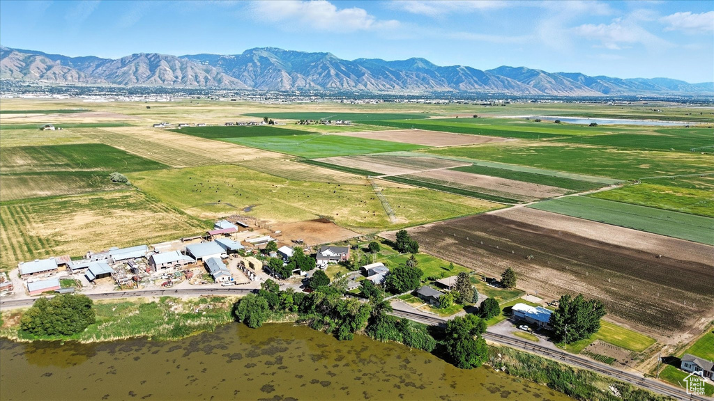 Overview of rural landscape featuring a water and mountain view