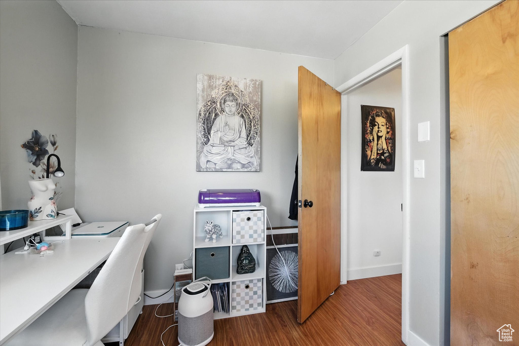 Office with wood finished floors