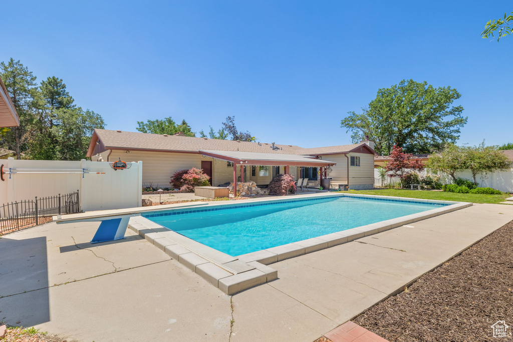 View of swimming pool with a patio