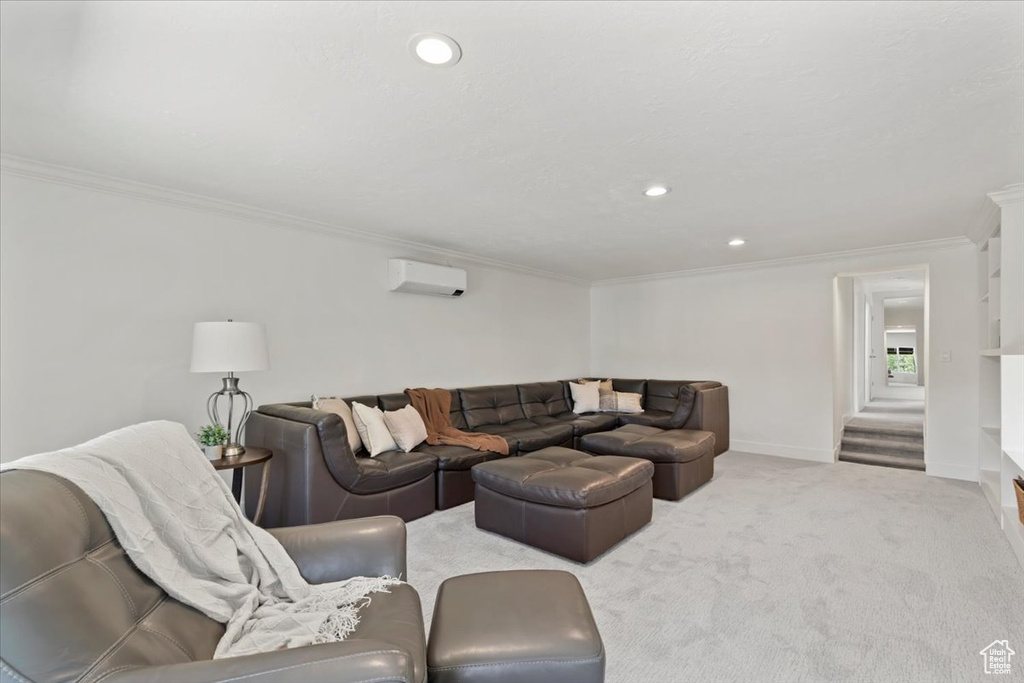 Carpeted living room with ornamental molding, recessed lighting, and a wall unit AC