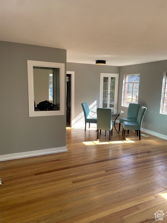Sitting room with hardwood / wood-style floors and baseboards