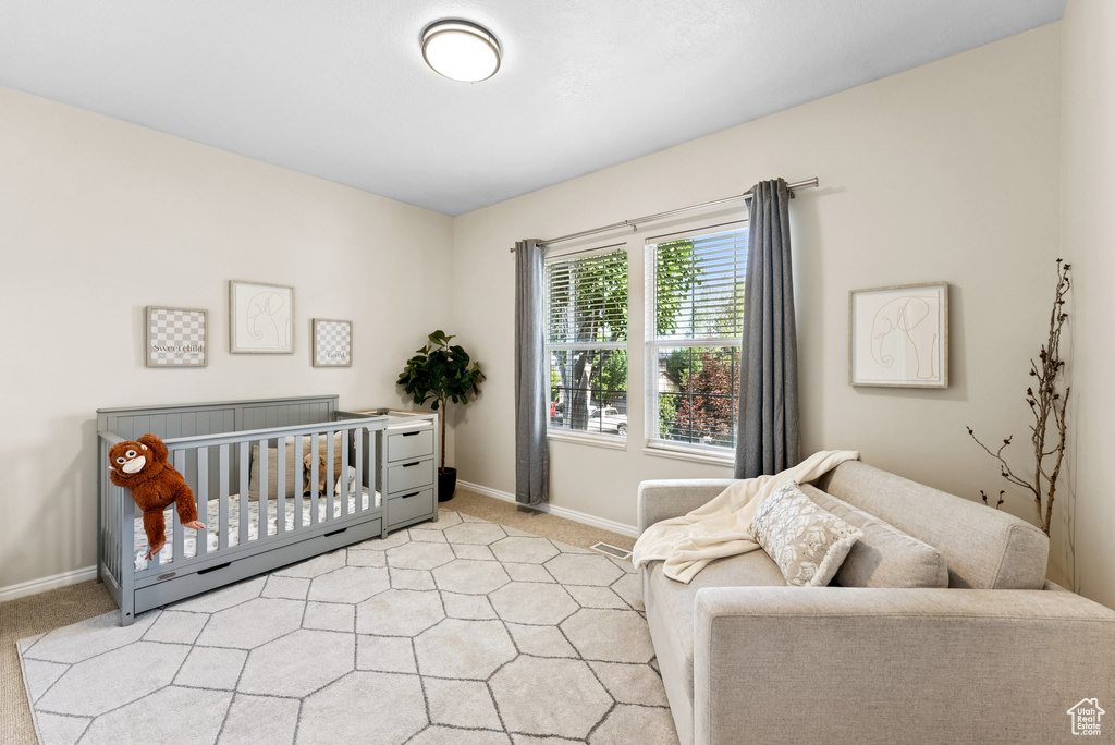 Bedroom with light carpet