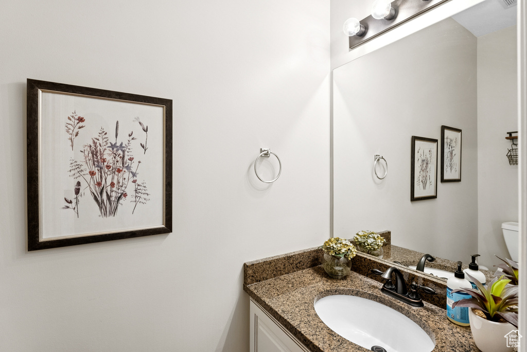 Bathroom with vanity and toilet