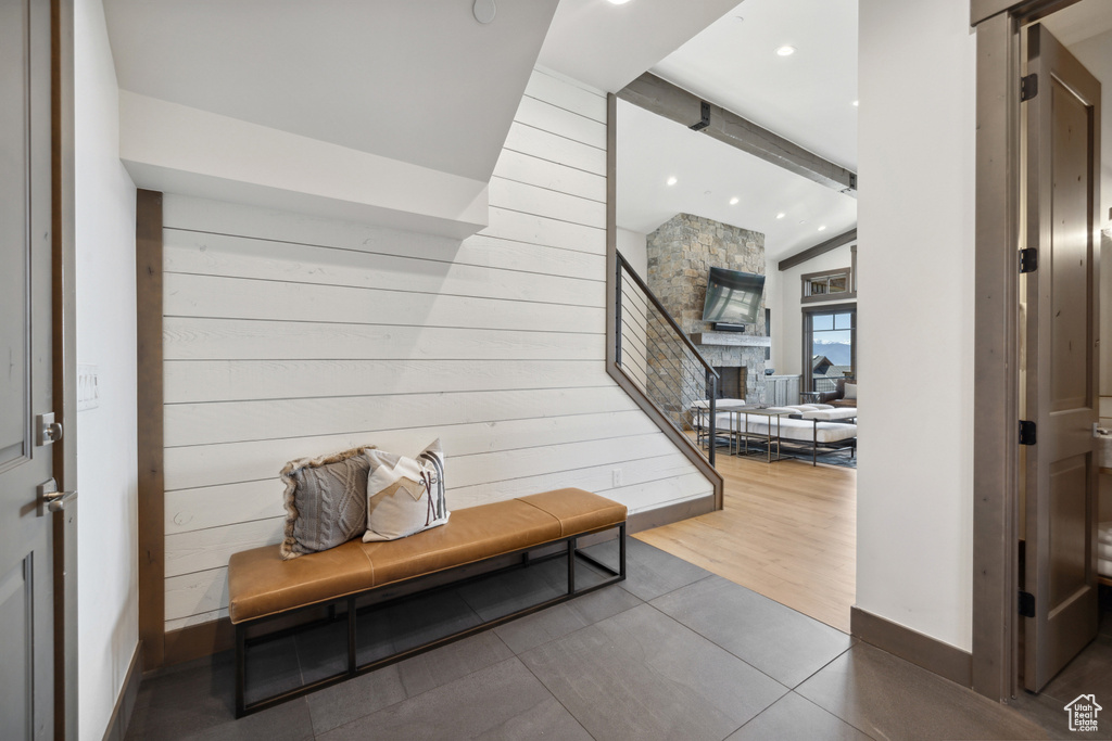 Hall with wood walls and recessed lighting