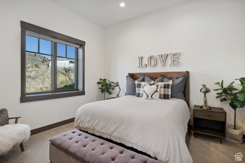 Carpeted bedroom featuring baseboards and recessed lighting