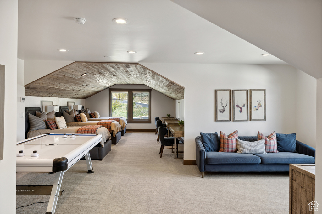 Game room with light colored carpet, recessed lighting, and vaulted ceiling