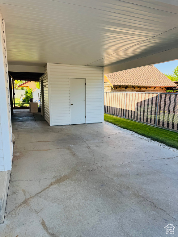 View of patio / terrace featuring a carport