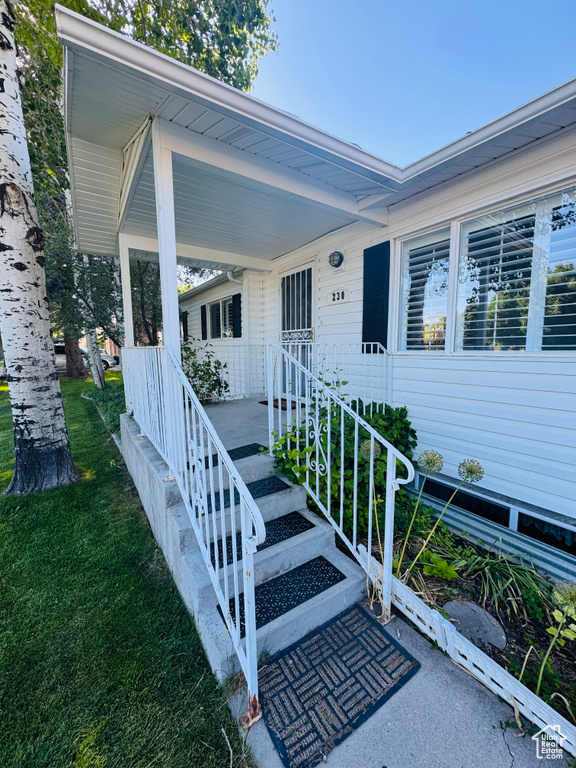 Entrance to property with a yard