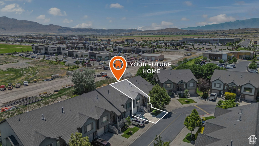 Aerial perspective of suburban area with mountains and property boundaries highlighted