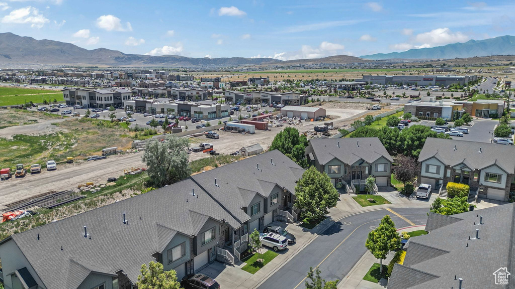 Aerial perspective of suburban area featuring a mountainous background