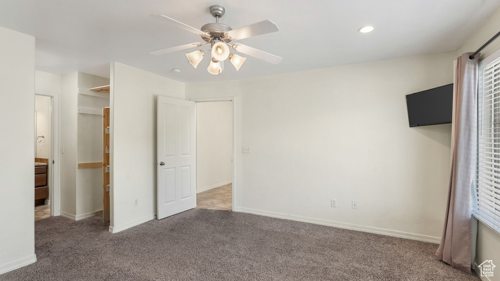 Unfurnished bedroom featuring carpet, recessed lighting, and a ceiling fan