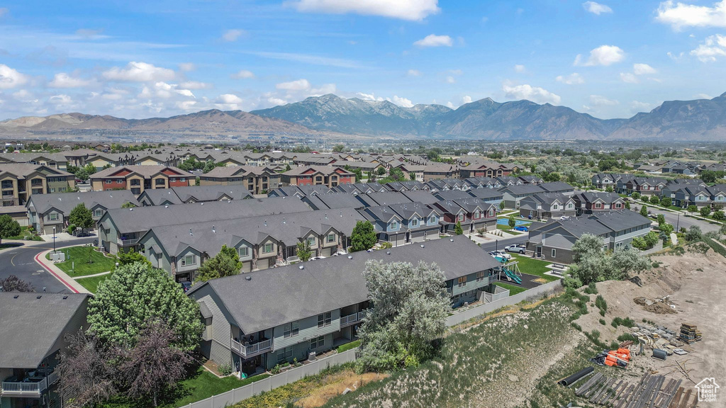 Aerial view of residential area featuring a mountain backdrop