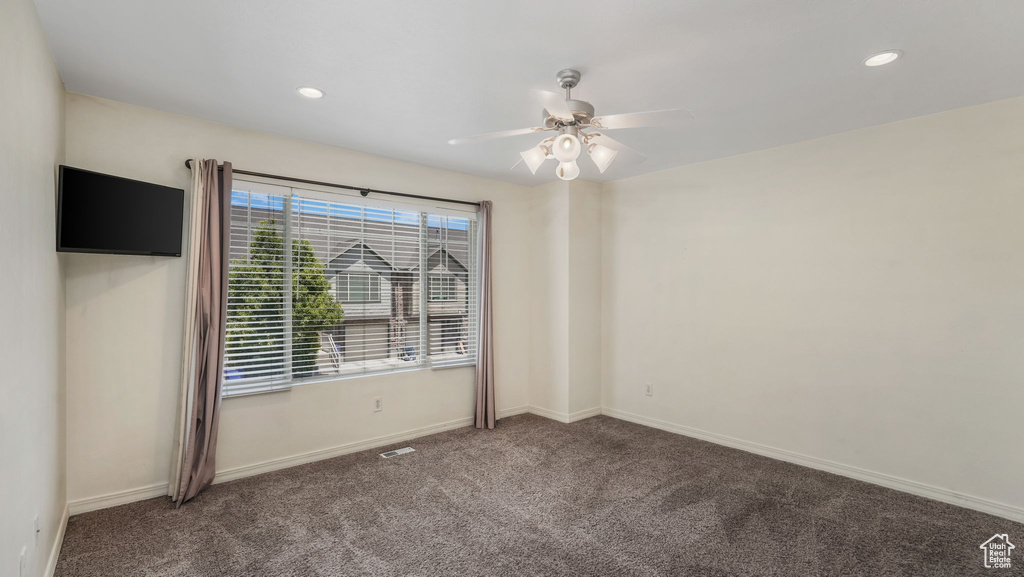 Empty room with carpet flooring, ceiling fan, and recessed lighting