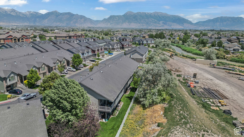 Aerial perspective of suburban area featuring a mountainous background