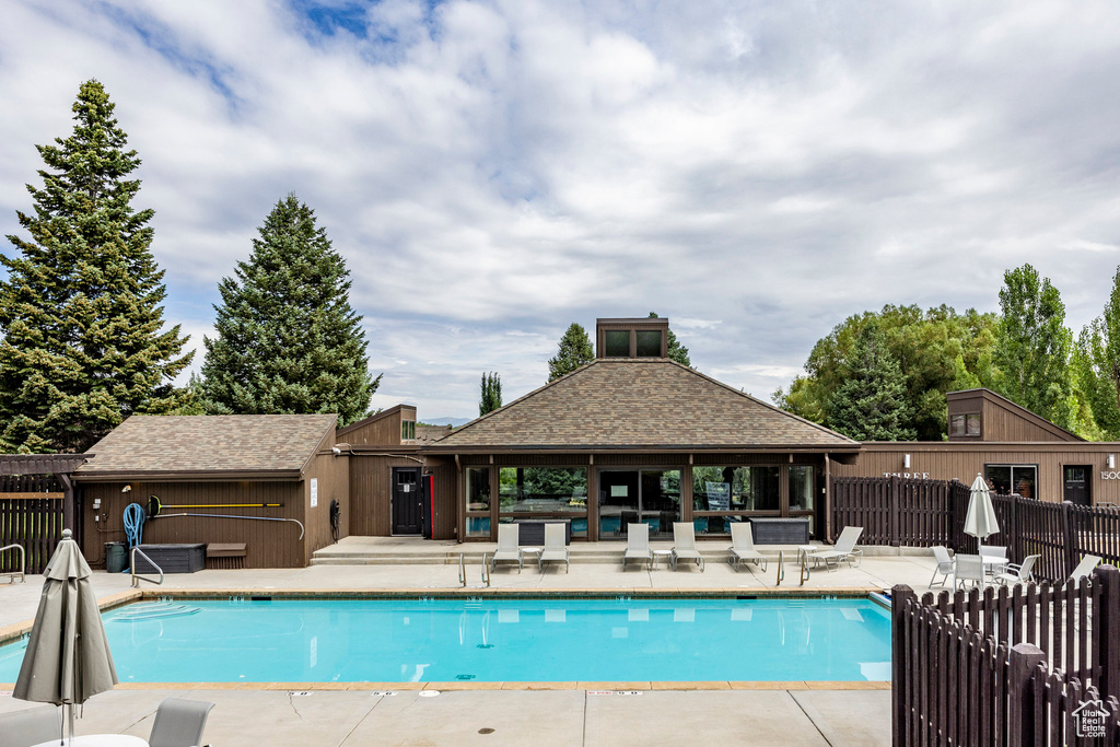 Community pool featuring a patio and a gazebo