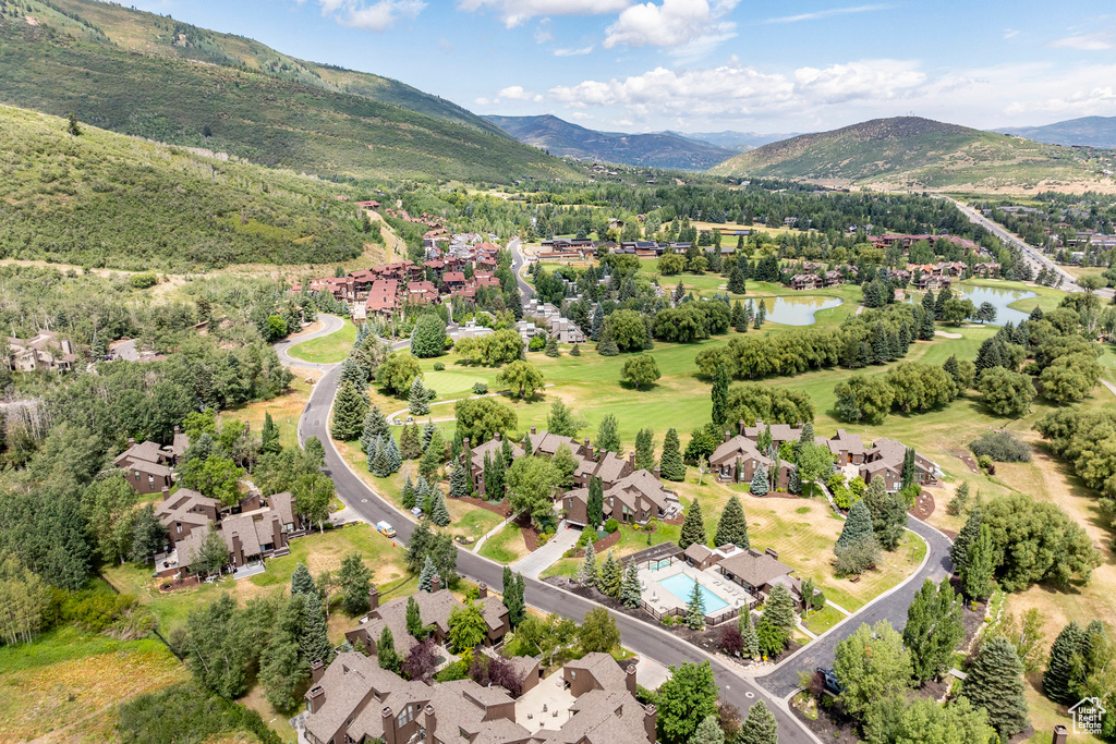 Aerial perspective of suburban area with a water and mountain view