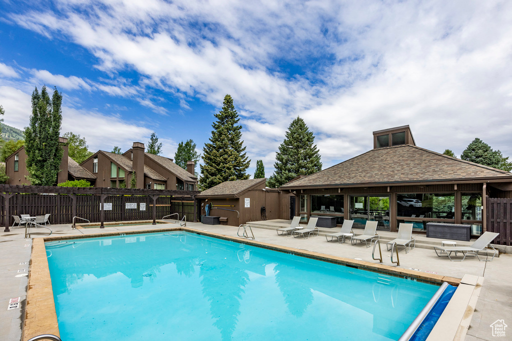 Community pool featuring a gazebo and a patio