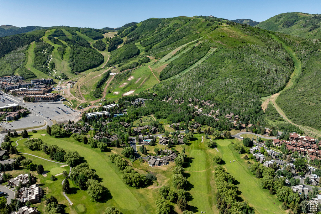 Aerial view of property's location featuring mountains