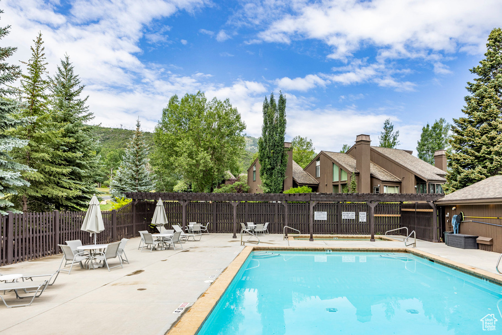 Community pool with a patio area