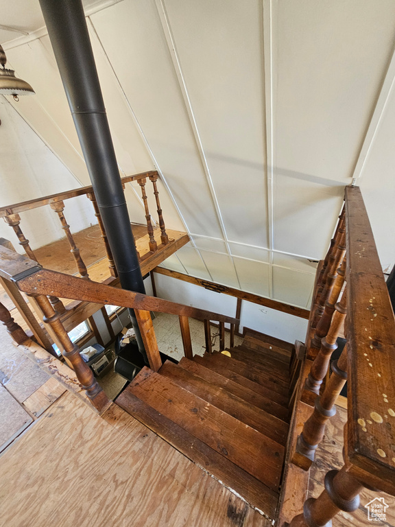 Stairs featuring wood finished floors