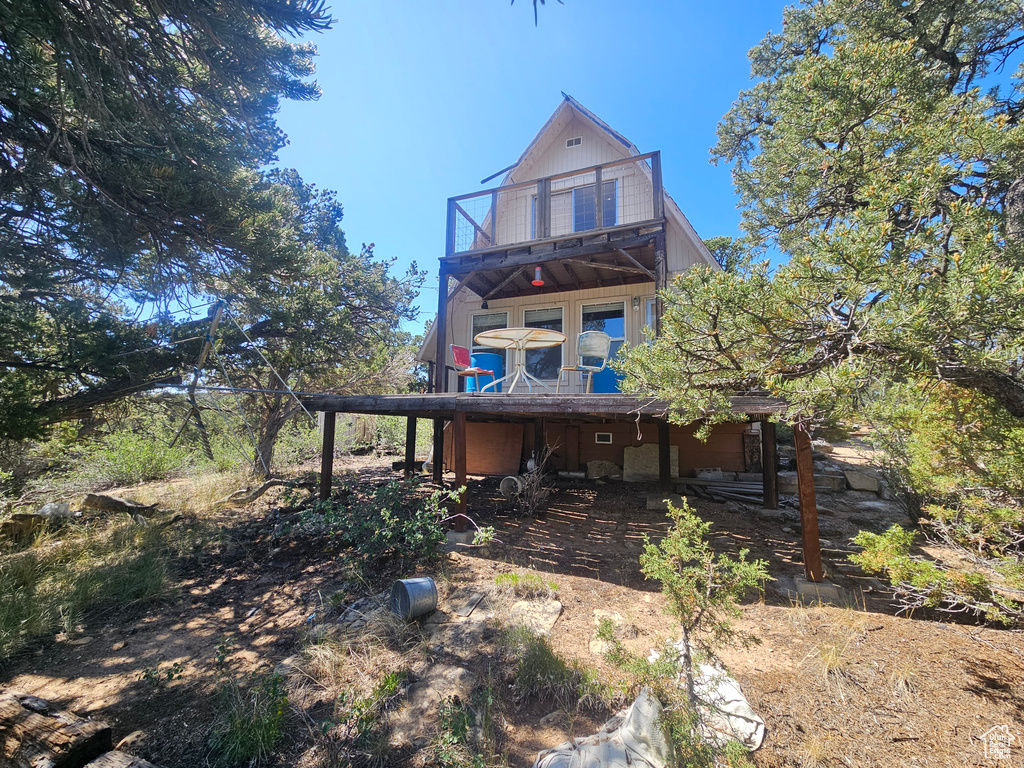 Rear view of property with a balcony
