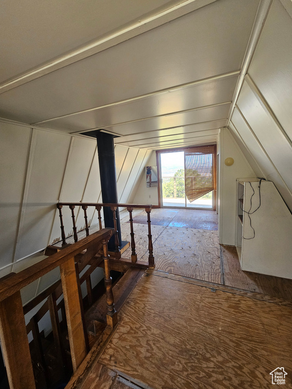Additional living space featuring lofted ceiling