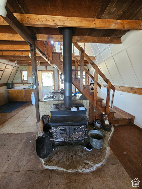 Staircase featuring a wood stove