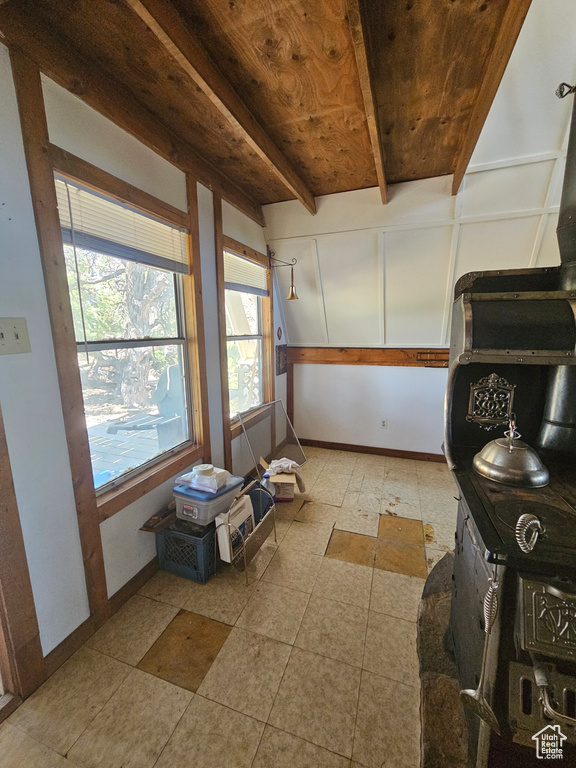 Sunroom / solarium featuring beam ceiling