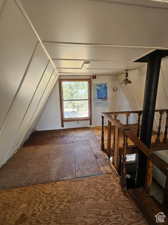 Additional living space featuring lofted ceiling