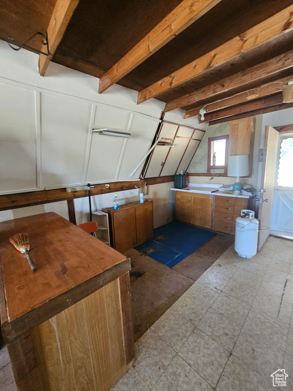 Kitchen featuring beamed ceiling