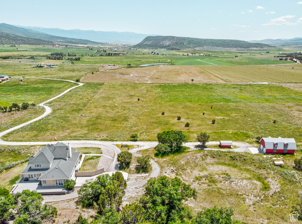 Aerial view of sparsely populated area featuring a mountainous background