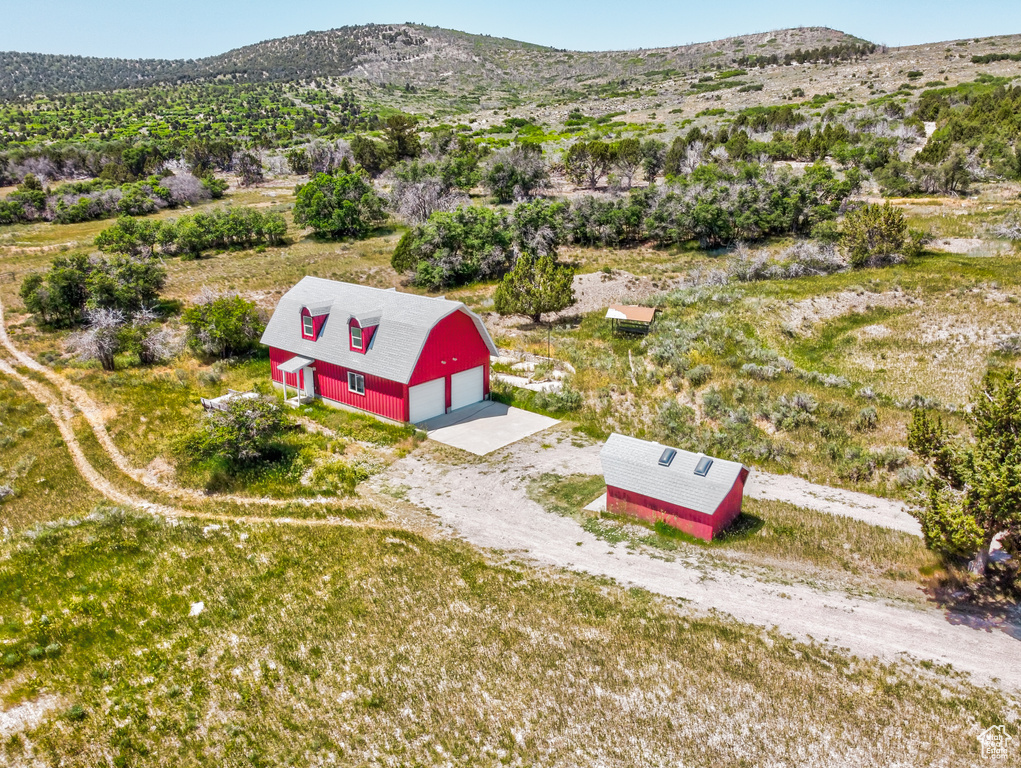 View from above of property with a mountainous background