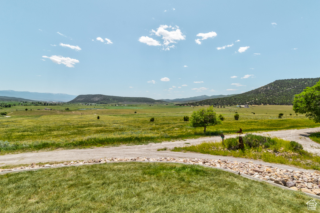 View of mountain backdrop featuring rural landscape