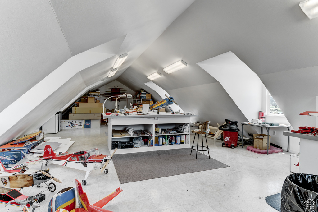 Additional living space featuring lofted ceiling