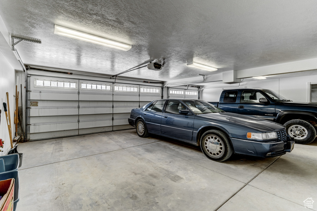 Garage featuring a garage door opener