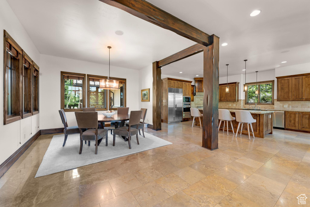 Dining area featuring baseboards and recessed lighting