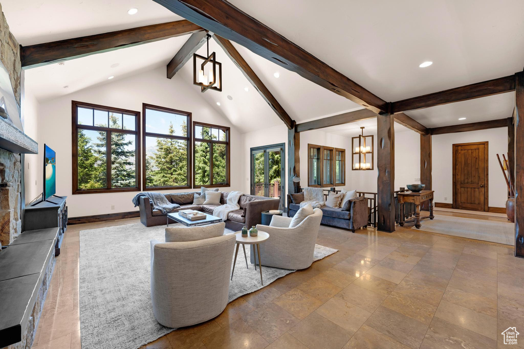 Living area with a chandelier, beamed ceiling, recessed lighting, and high vaulted ceiling