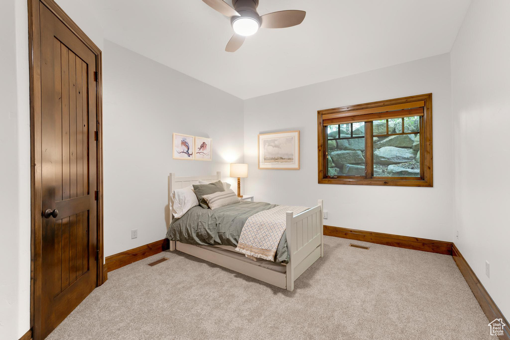 Bedroom with carpet and ceiling fan