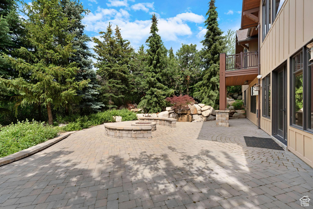 Patio / terrace with an outdoor fire pit and a patio