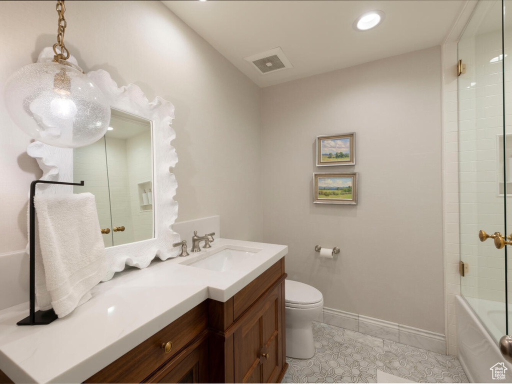 Full bath featuring vanity, tub / shower combination, tile patterned flooring, and recessed lighting