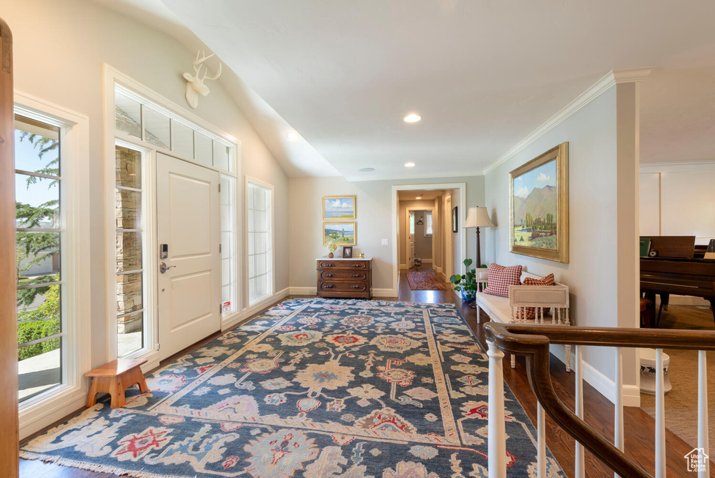 Foyer entrance featuring recessed lighting and crown molding