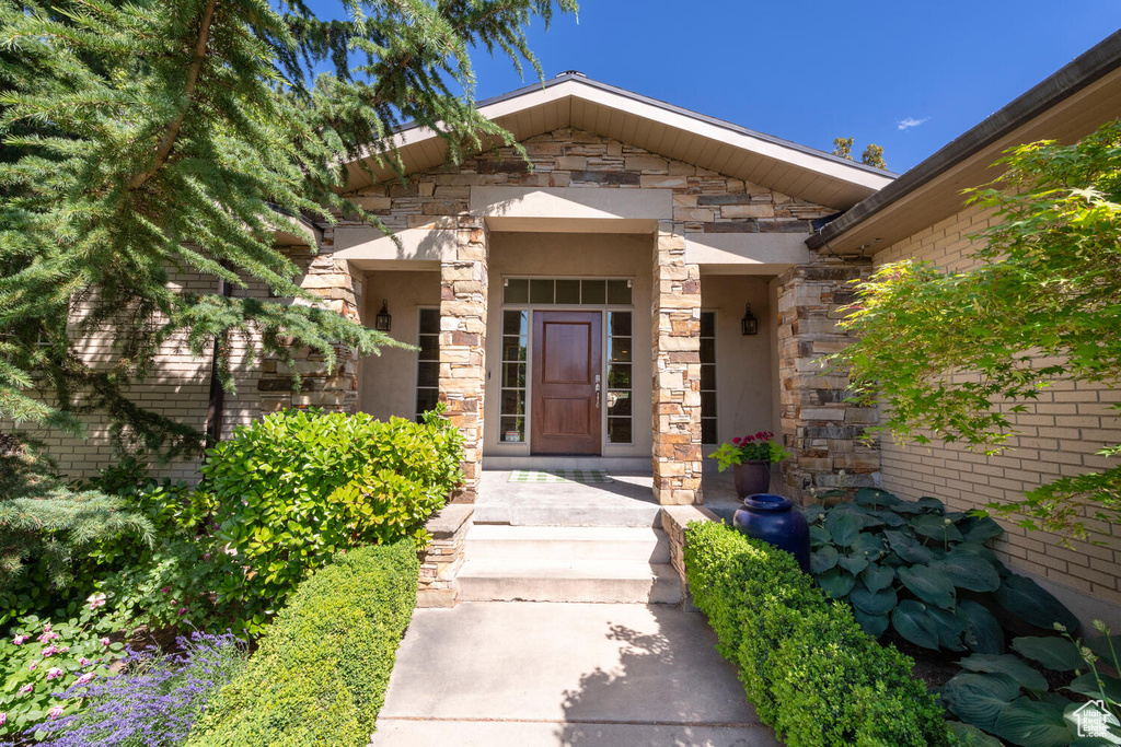 Property entrance with stone siding