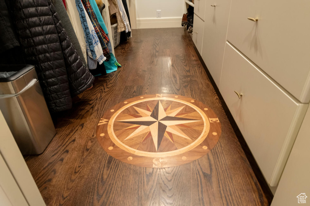 Hall with wood finished floors and baseboards