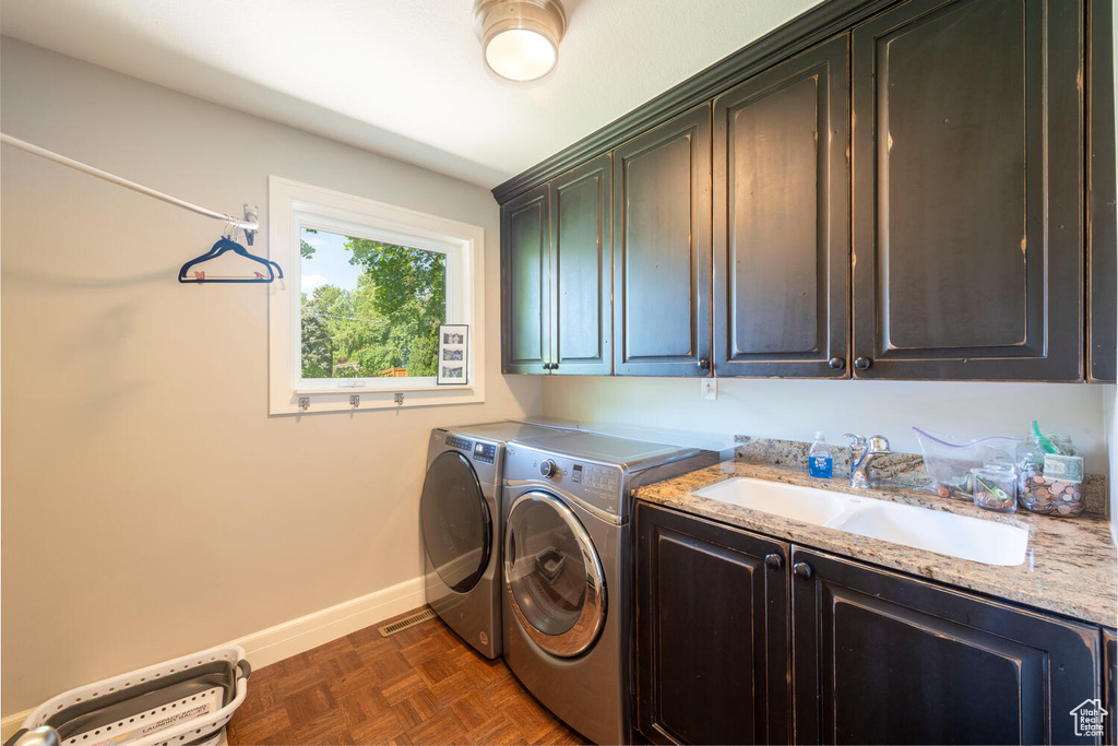 Washroom with cabinet space and independent washer and dryer