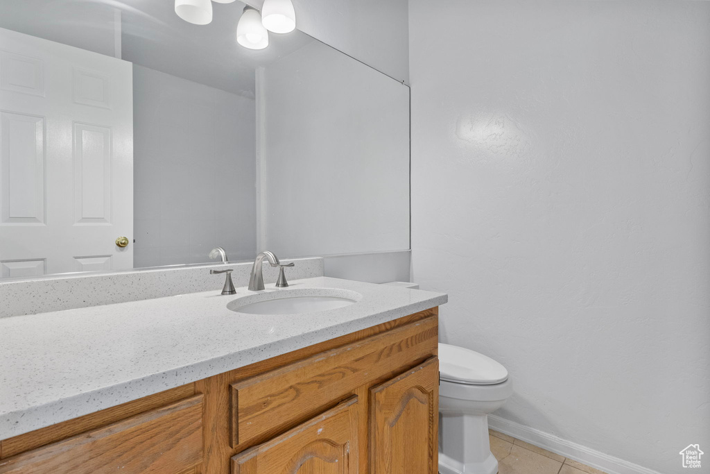 Bathroom featuring vanity and tile patterned floors