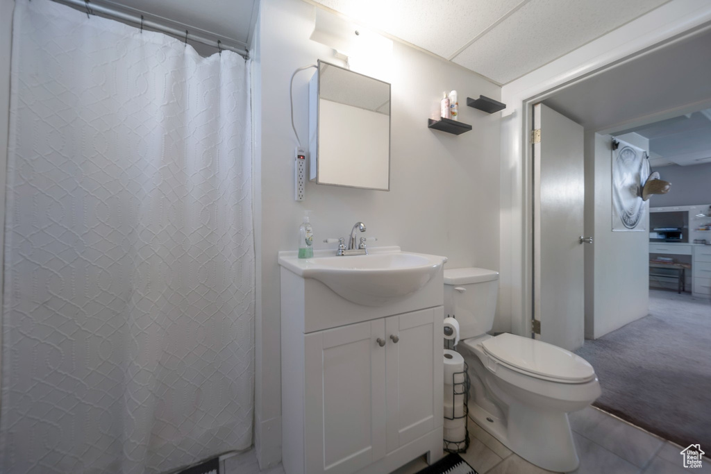 Full bathroom featuring vanity and curtained shower