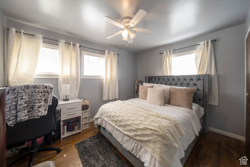 Bedroom featuring wood finished floors and ceiling fan